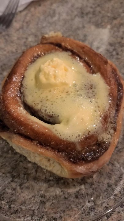 Cutthroat Cafe - A homemade cinnamon roll covered in melted butter. - Breakfast & Brunch Near Me - Bailey, Colorado