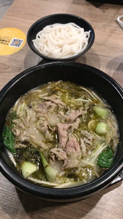 Ludingji Noodles - Pickled veggie soup base + sliced need + noodle + pot combination.  The redness of the soup is from the chilli I've added. - Chinese Near Me - San Gabriel, California