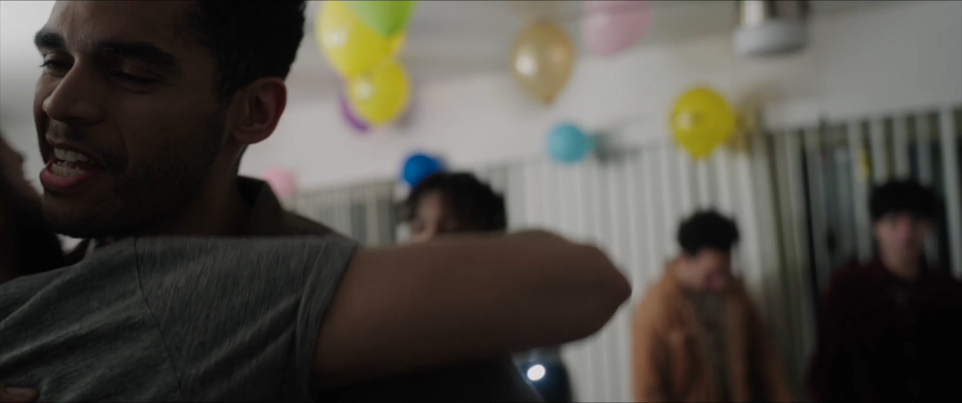 A group of friends coordinate a surprise birthday gathering via text message before celebrating together in a festive, decorated space. The scene captures the transition from digital communication to real-world social connection.