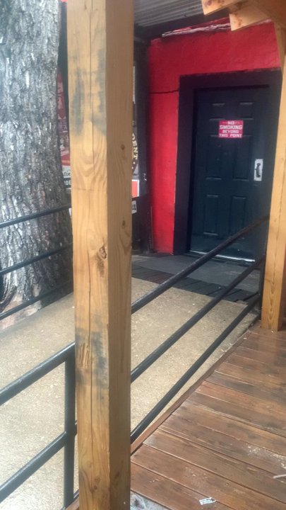 Caves Lounge - Patio is a great spot!!  It's raining but stayin dry under the covered bar and several other areas with tables covered for rain & sun!! - Dive Bars Near Me - Arlington, Texas