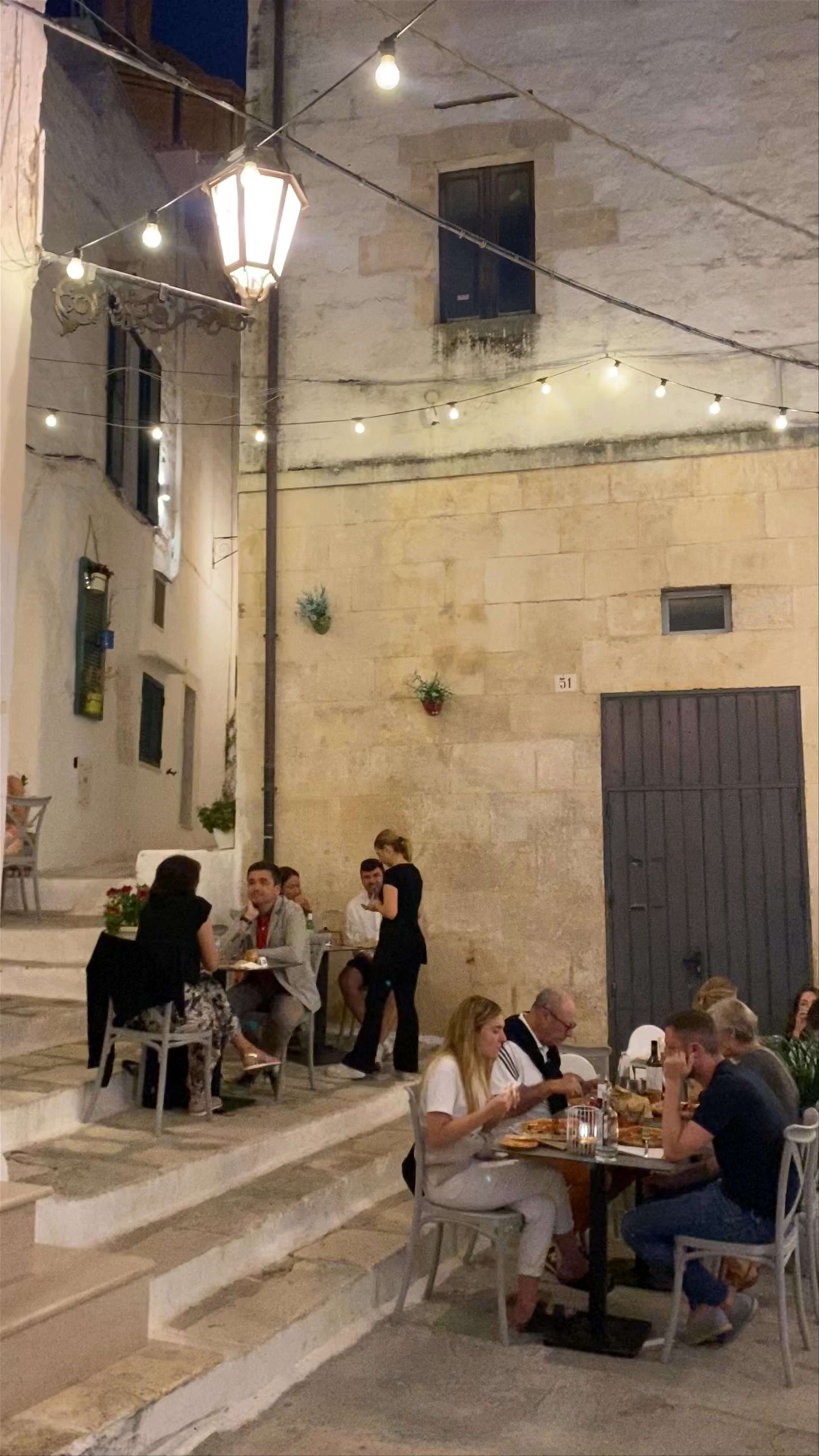 Evening Dining in the Charming Streets of Ostuni, Italy