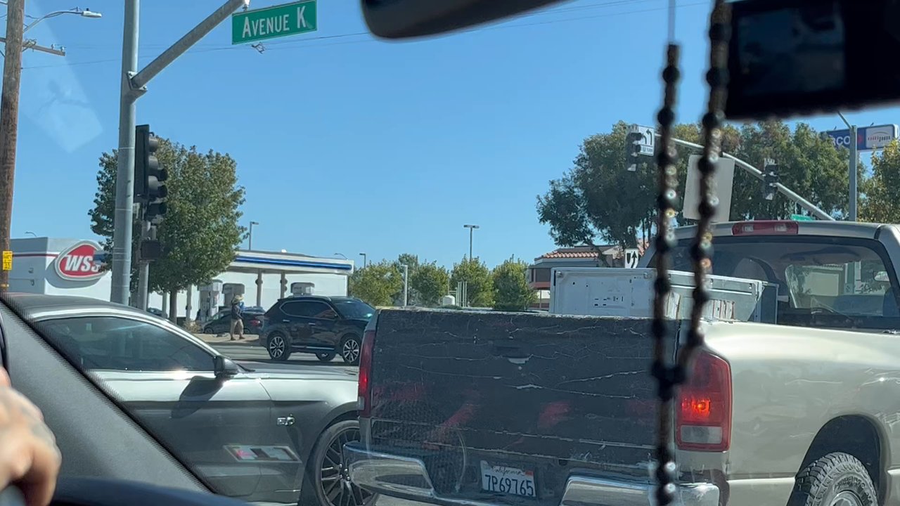 Quick Quack Car Wash - People are all around with banners - Car Wash Near Me - Lancaster, California