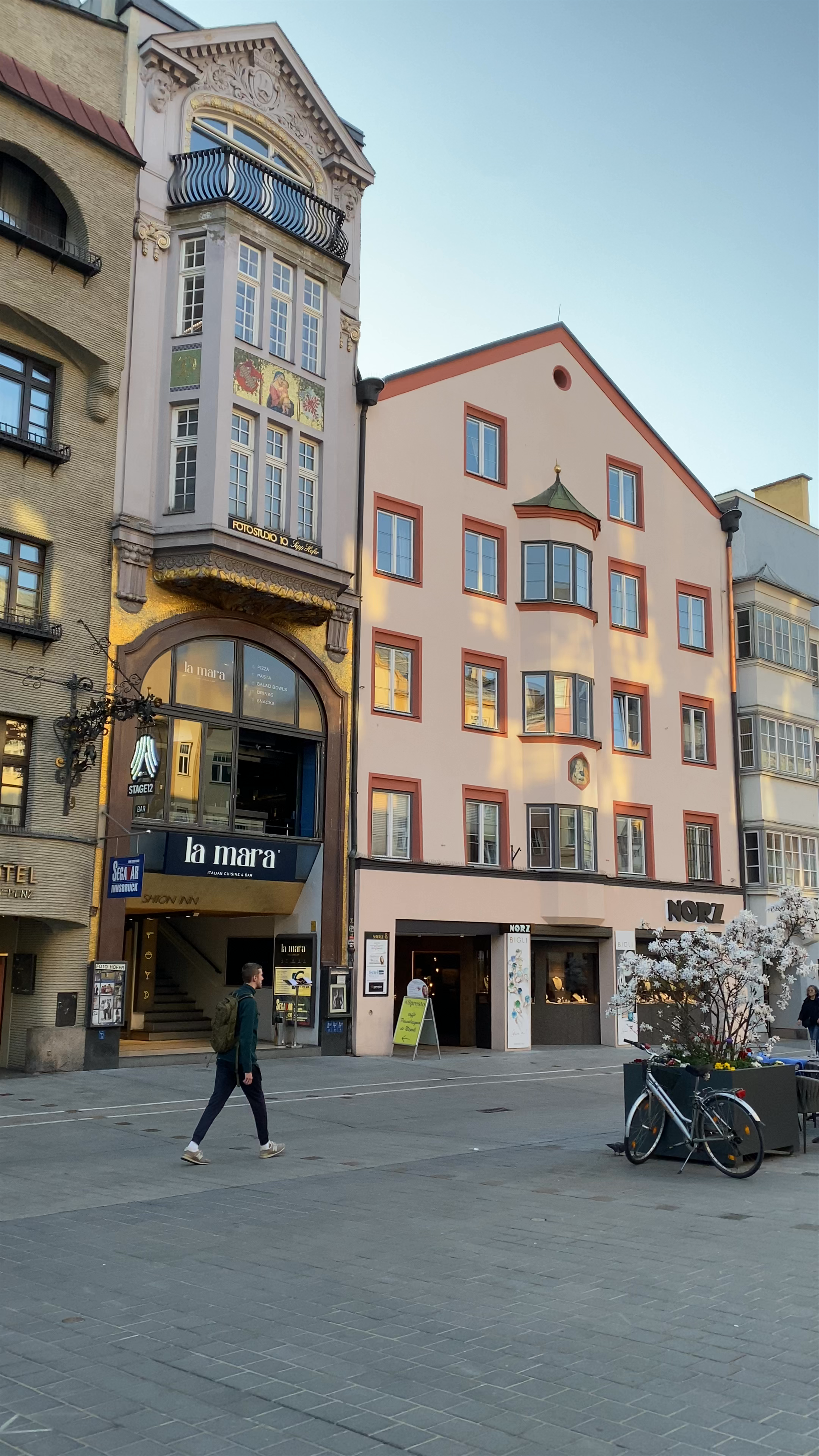 Strolling Through Maria-Theresien-Straße, Innsbruck with Alpine Views