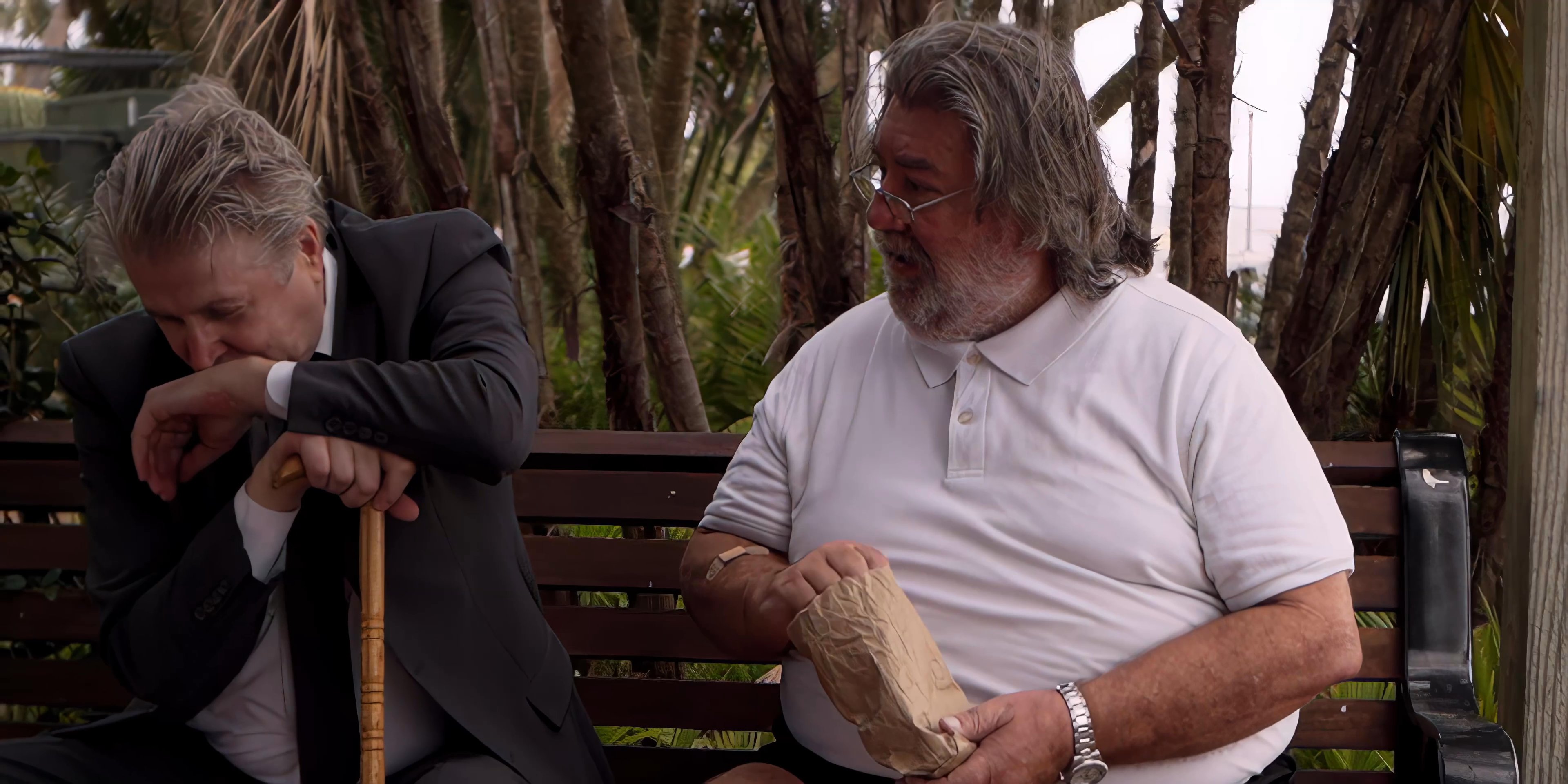 Two distinct pairs of men engage in separate conversations while resting outdoors. The scenes capture the interpersonal dynamics and casual exchanges between the individuals in a natural setting.