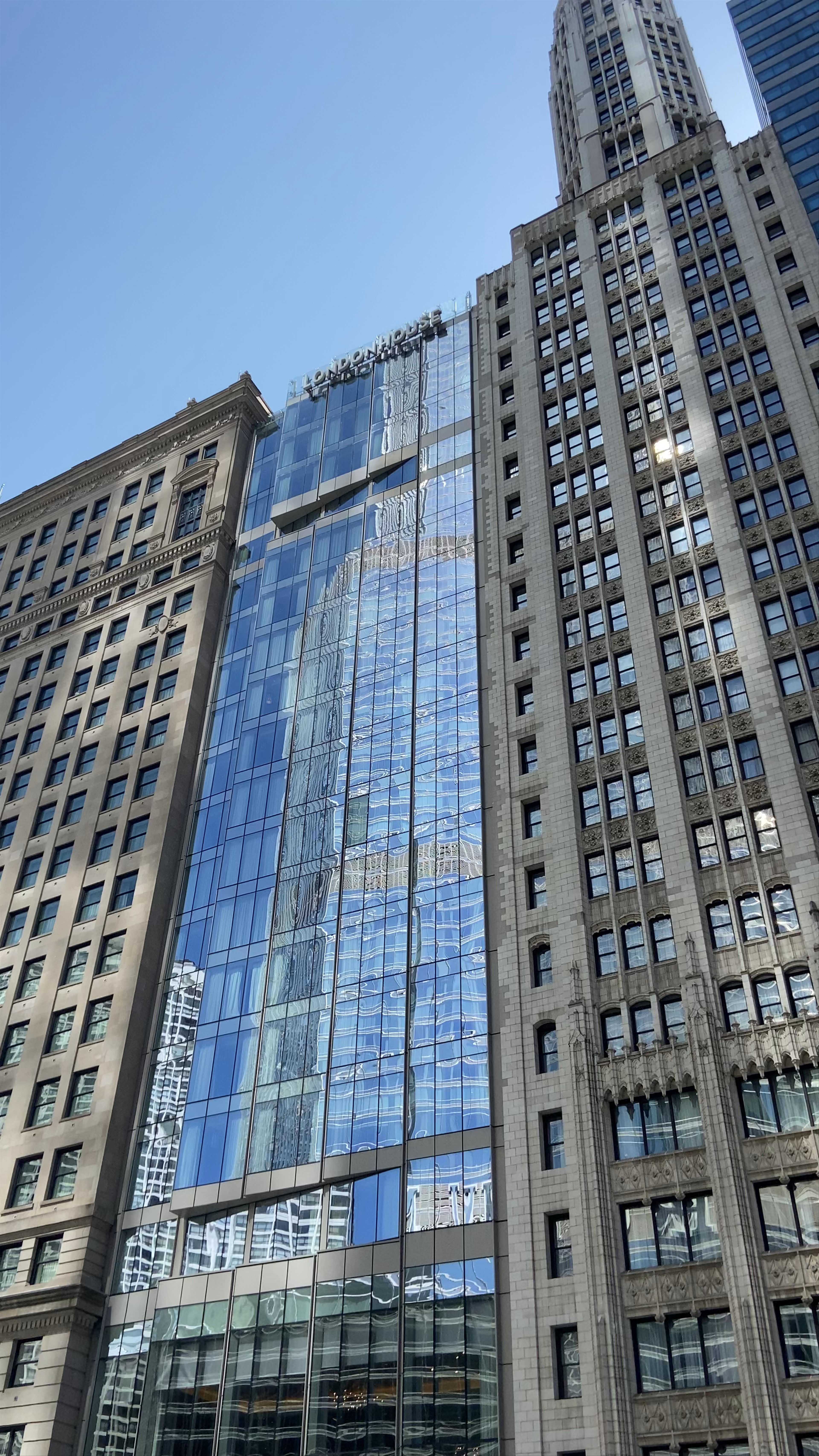 Chicago Urban Reflection: Architectural Glass Facade at Noon