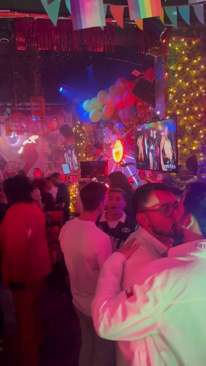 Peuteo - Inside the bar along with a picture of the outside, where there's seating - Gay Bars Near Me - Buenos Aires, C