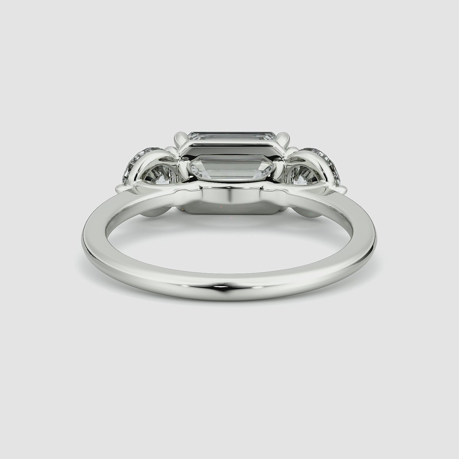 The Three Stone | Emerald | Platinum | bandAccent: Plain | diamondOrientation: horizontal | sideStoneCarat: 0.50ct | sideStoneShape: Round Brilliant | caratWeight: other