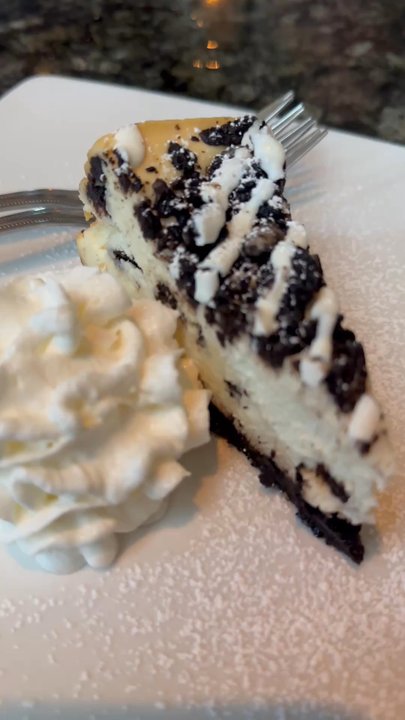 Blinkers Tavern - This is the cookies and cream cheesecake and it was really decadent and really yummy and I really appreciate a homemade whipped cream too. - Steakhouses Near Me - Covington, Kentucky