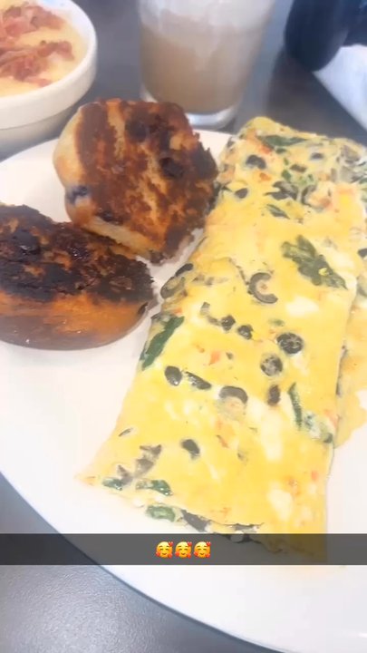 Eggs Up Grill - Greek omelet with garlic cheese grits, bacon, and blueberry muffins. He has Philly cheesesteak with home fries! - Breakfast & Brunch Near Me - Meridian, Mississippi