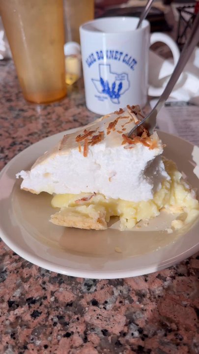 Blue Bonnet Cafe - Digging in the coconut meringue pie - Desserts Near Me - Marble Falls, Texas
