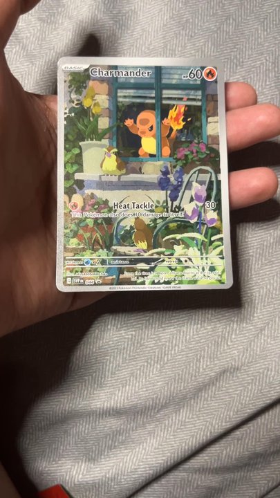 ToyLynx - Charmander card was bent, and palafin card was bent curving into one direction - Toy Stores Near Me - Honolulu, Hawaii