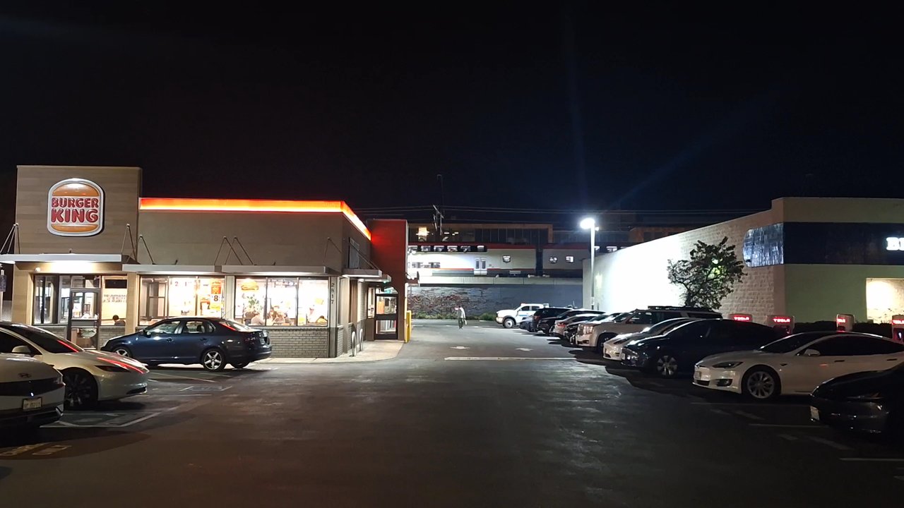 Burger King - Outside with the Tesla chargers, Caltrain, Roblox and Big 5. - Fast Food Near Me - San Mateo, California