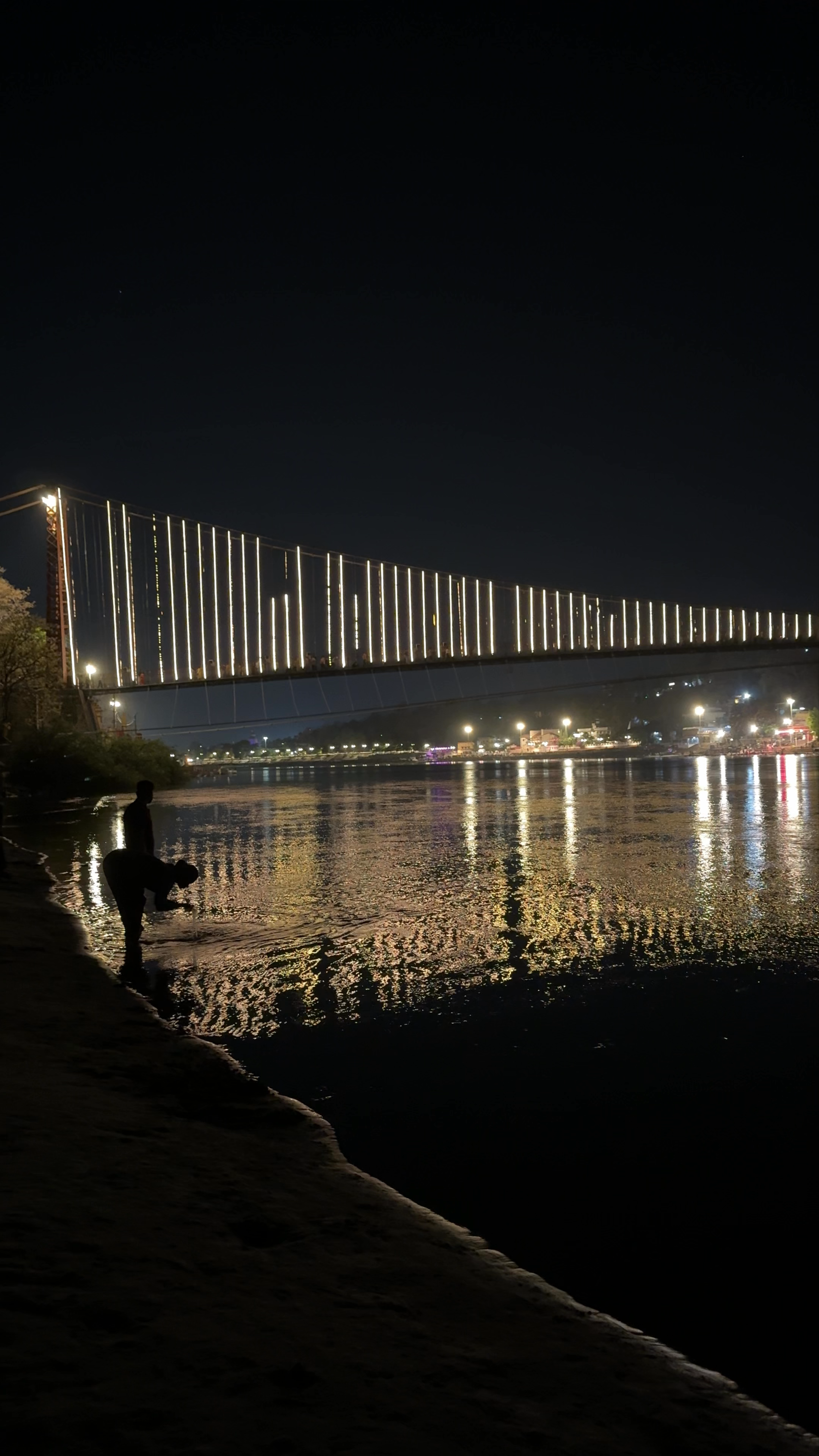 Ram Jhula at Night: Illuminated Suspension Bridge in Rishikesh
