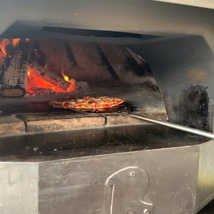 Full Moon Pizza - We use a wood-fired oven and northern Michigan hardwoods to cook gourmet pizzas that taste wonderfully smoky and crispy. They are delicious! - Food Trucks Near Me - Petoskey, Michigan