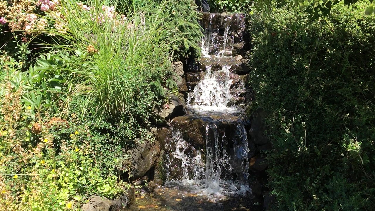 NW Pond Services - This a beautify water fall after cleaning - Landscaping Near Me