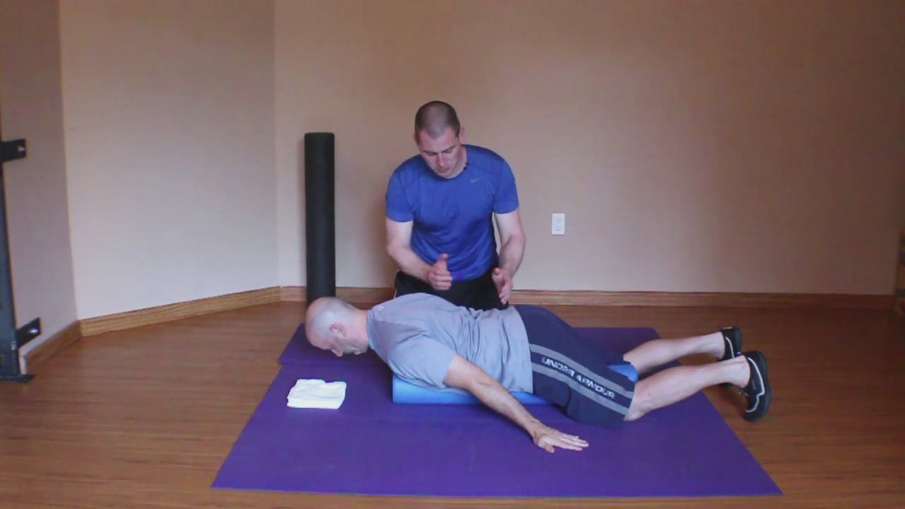 Prone Cobra on Foam Roll (Activation for muscles of the scapula, thorax & deep cervical flexors)