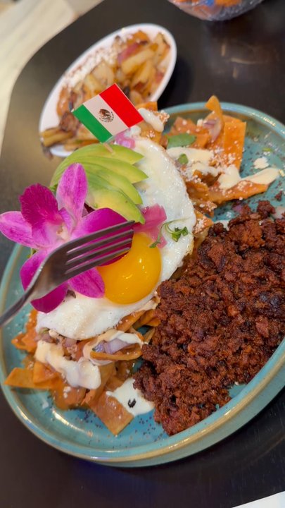 The Brunch Spot - Chilaquiles with chorizo, sunny side up eggs, potatoes and beans - Breakfast & Brunch Near Me - Hemet, California