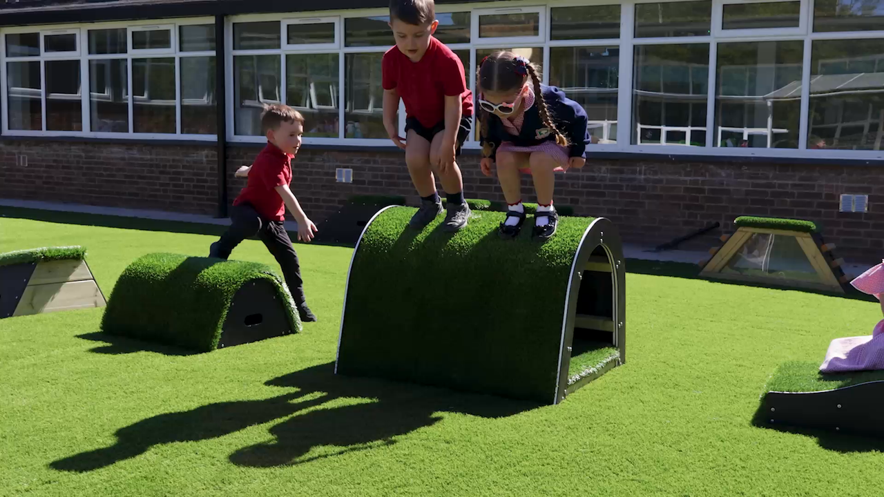 A group of school children playing in a school playground