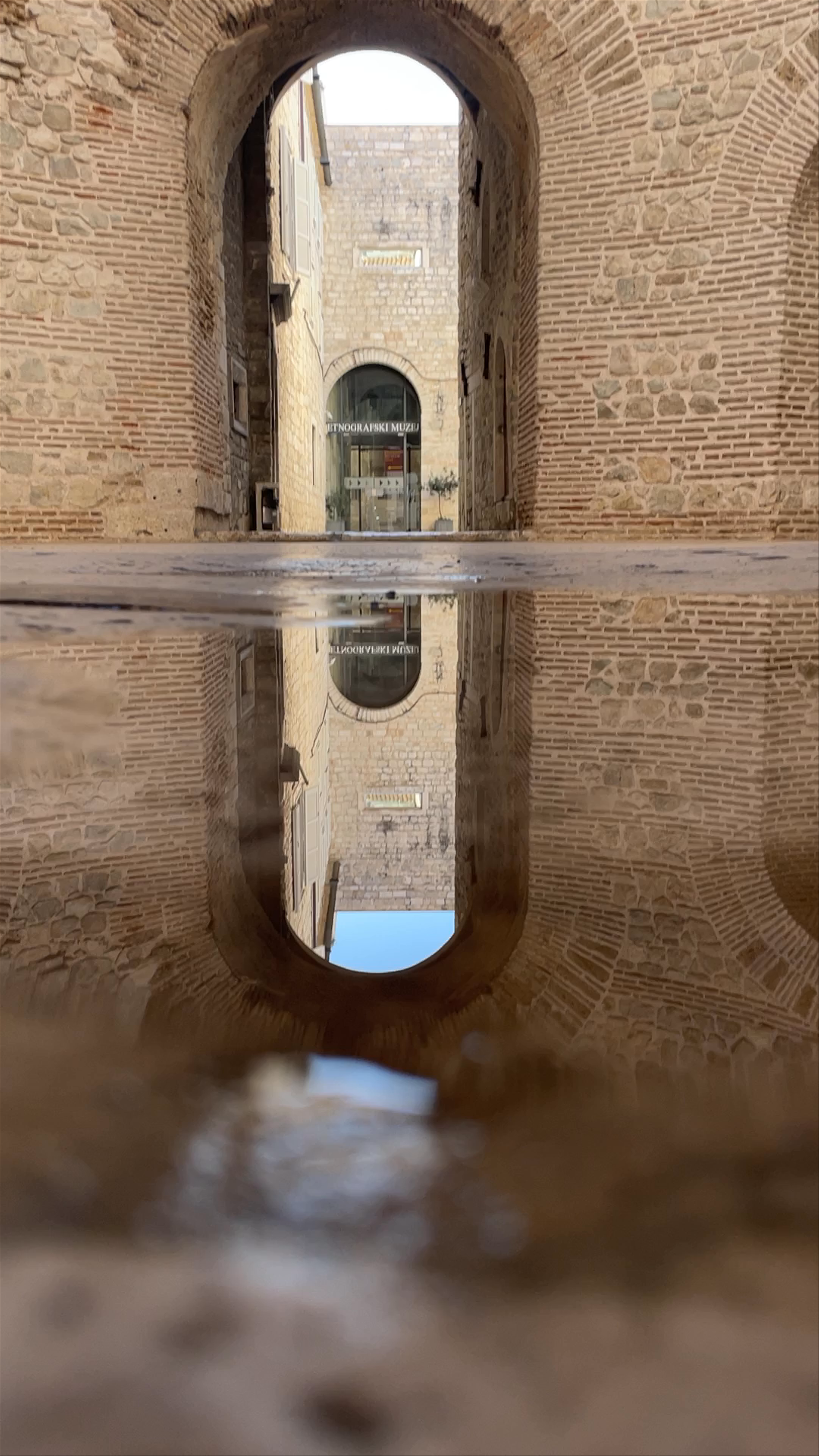 Historic Stone Archways and Reflections at Vestibul, Split