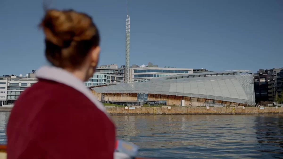 A woman travelling from Oslo to Bygdøy by boat and visiting the Kon-Tiki museum and a stave church.