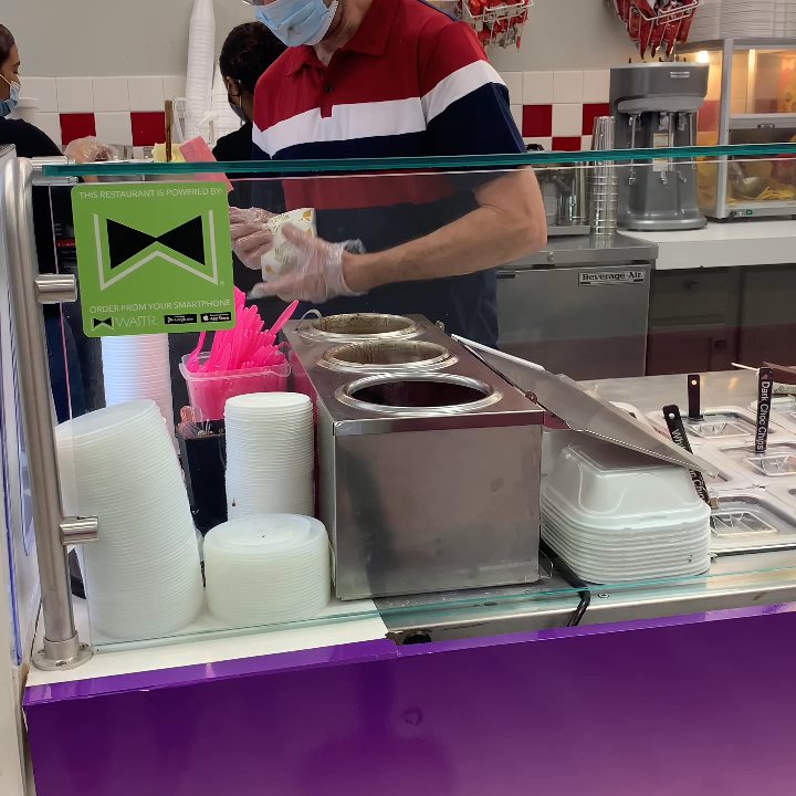 Popaletas - Baton Rouge - The owner expertly dipping an ice cream in chocolate! Heavenly! - Desserts Near Me - Baton Rouge, Louisiana