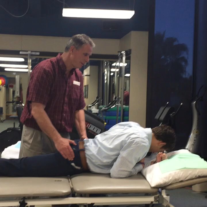 Harbor Physical Therapy - Mike showing me how to have my husband stretch my hip flexors, with and without my injured knee!  He hams it up a lot!! - Physical Therapy Near Me - San Pedro, California