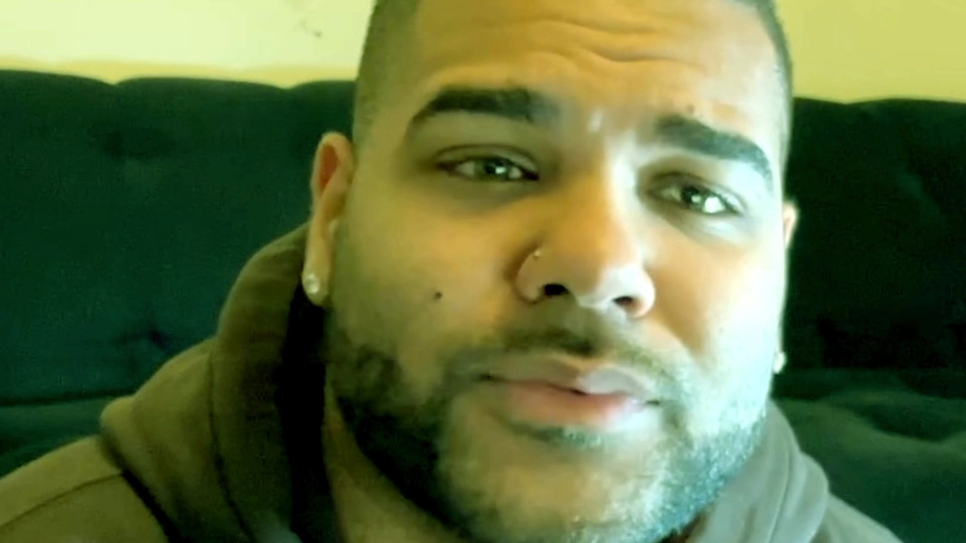 A man speaks directly to the camera, sharing his thoughts and engaging in a candid, conversational discussion.