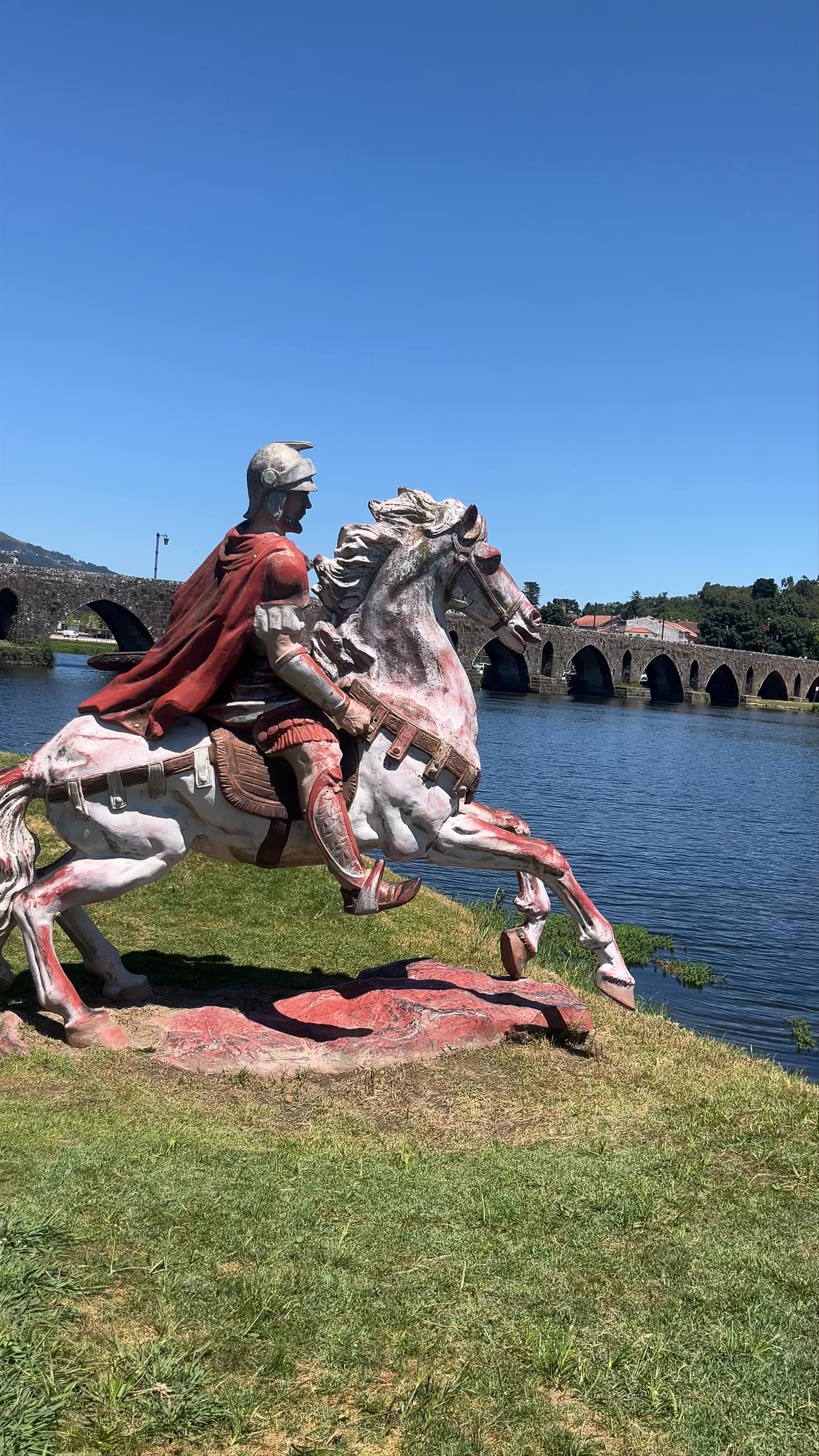 Historic Roman Statue by the River in Ponte de Lima, Portugal