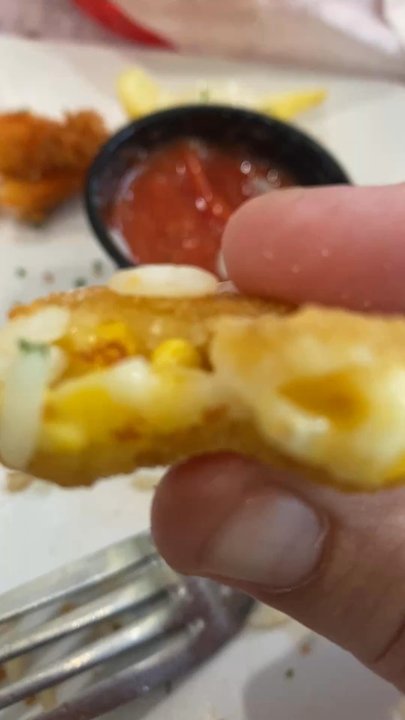 Sizzler - I don't know what this is but my husband liked it. I think it's like a fried corn bread ball. - Seafood Near Me - Fresno, California
