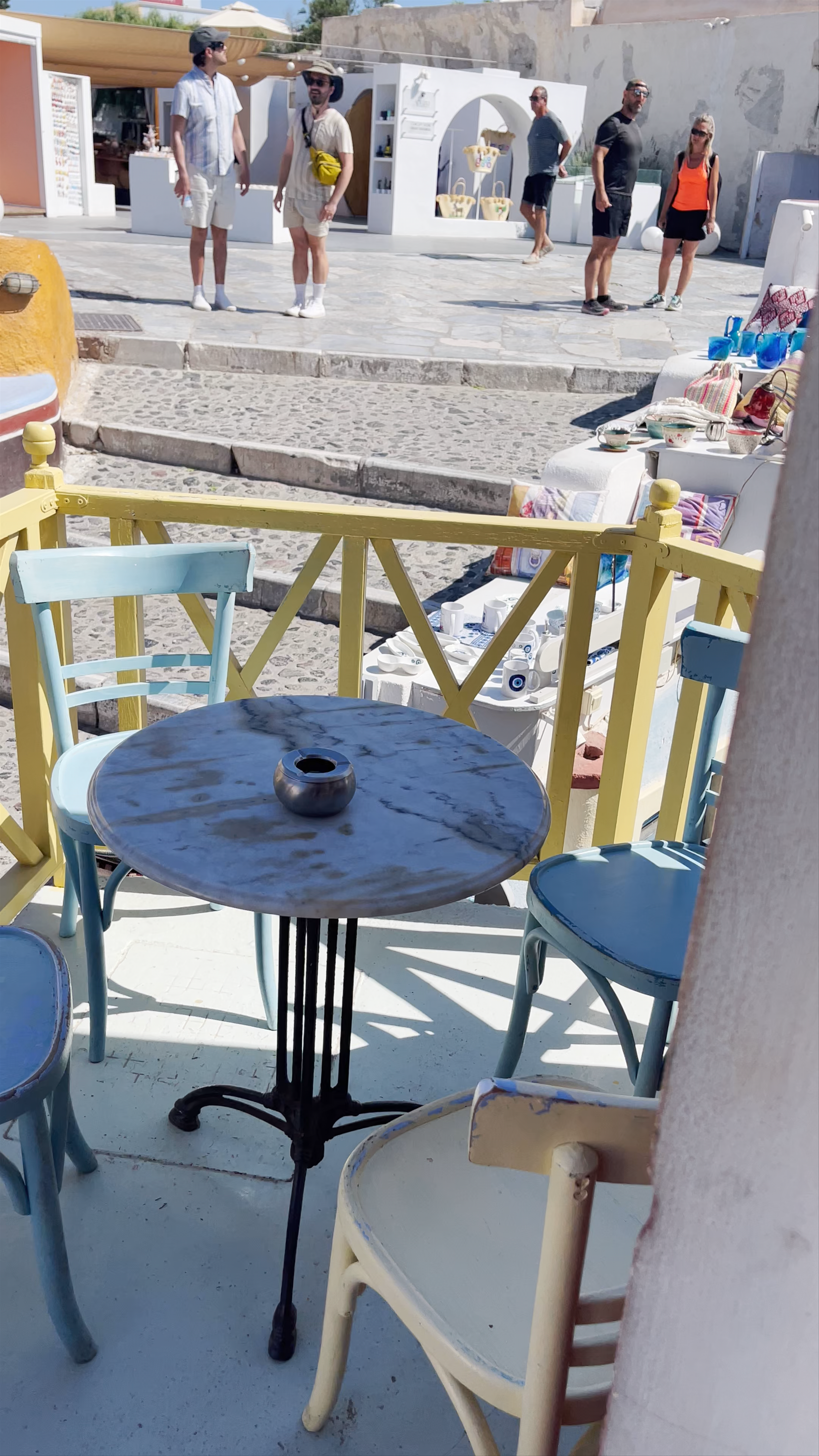 Charming Outdoor Cafe Scene in Oia, Santorini