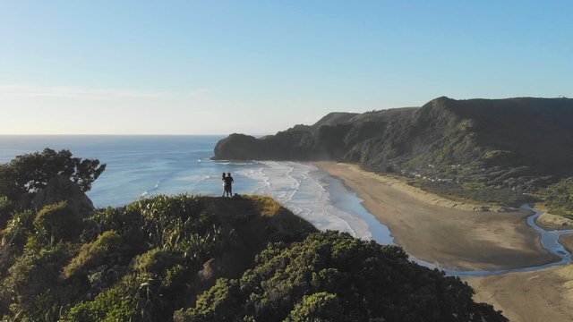 Standing on a rock near Piha Ocean