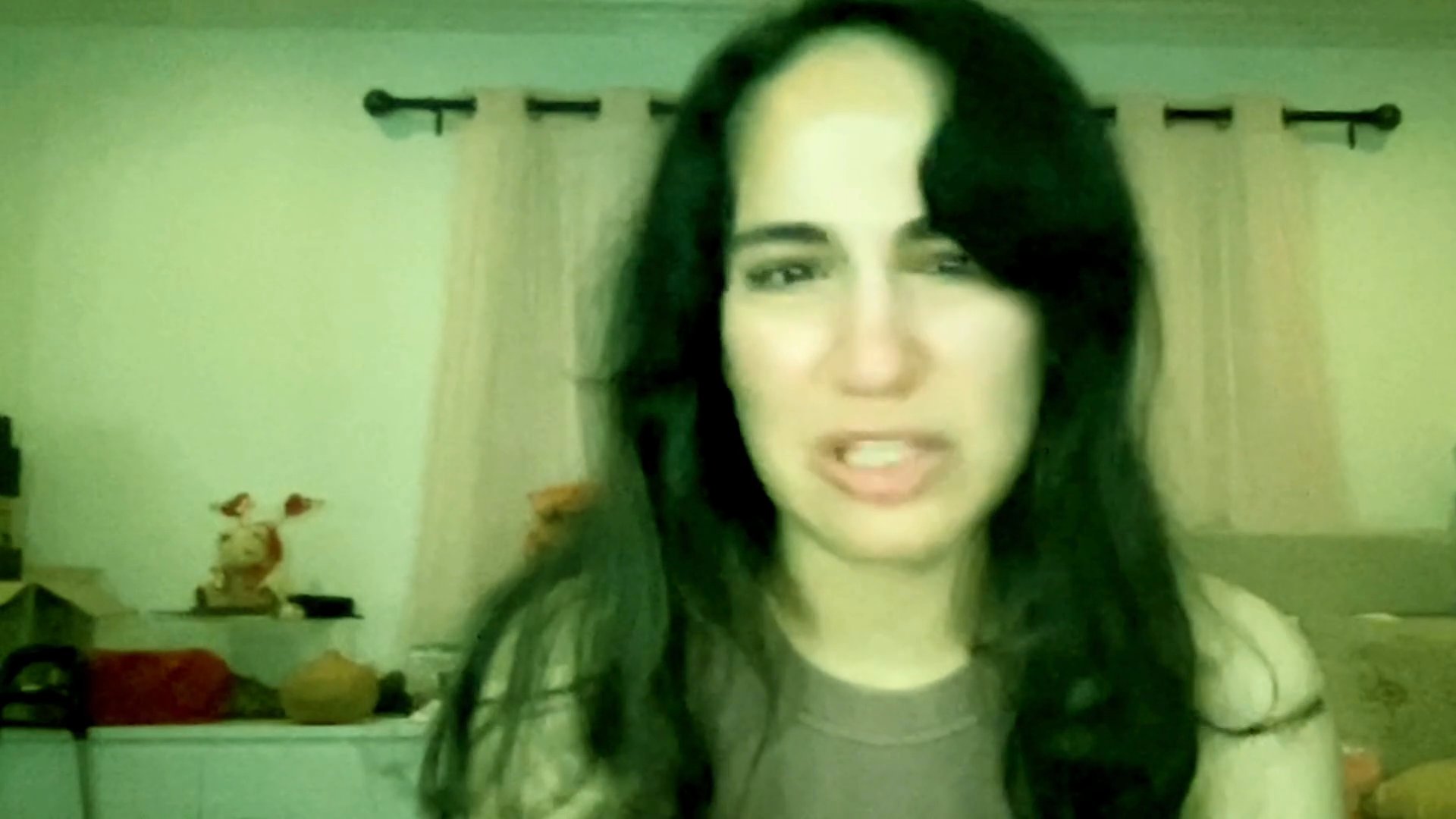 A woman expresses visible distress and sadness while talking, followed by a man responding with a serious and attentive demeanor.