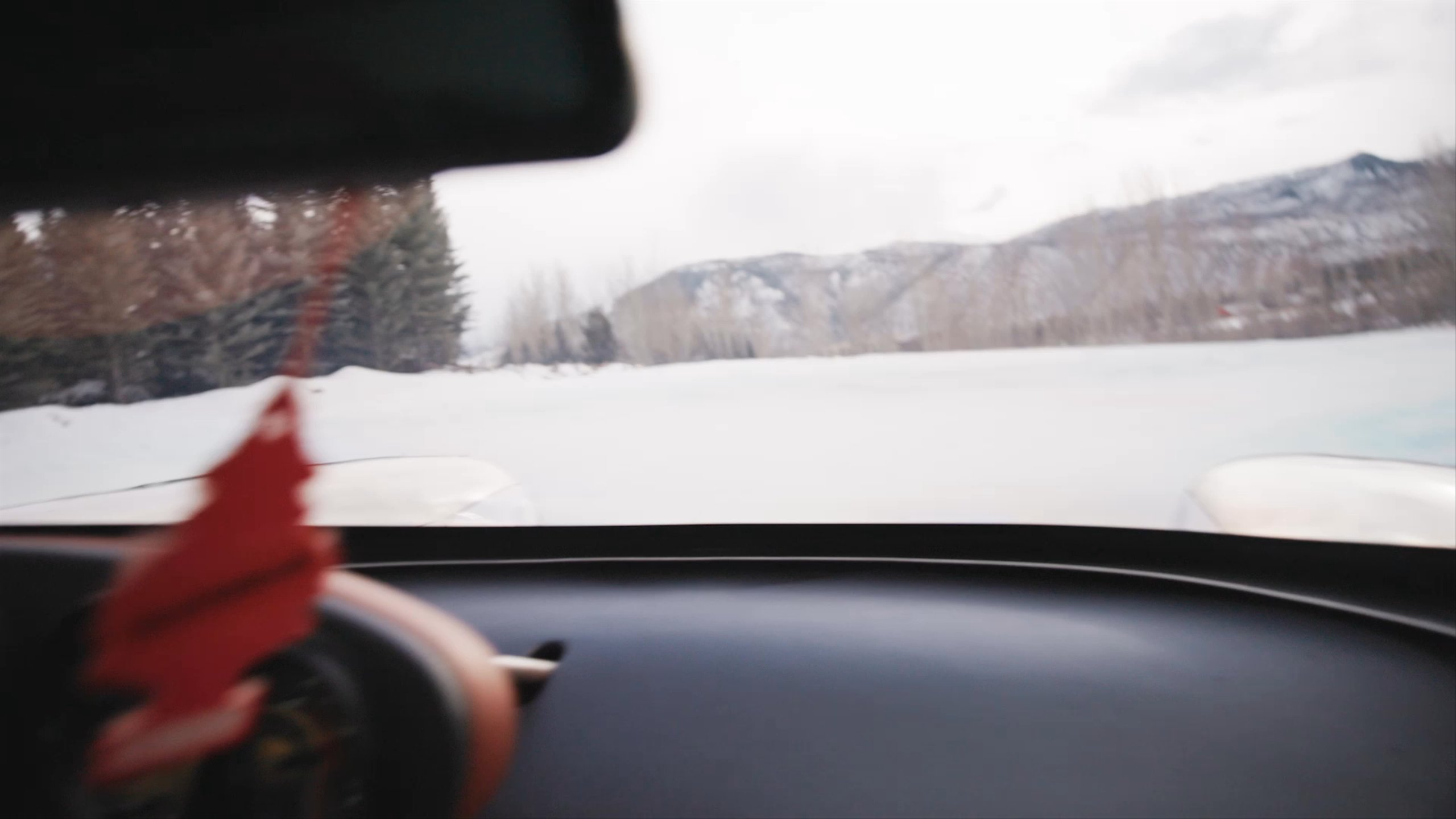 Video inside car of driver steering on the icy race track