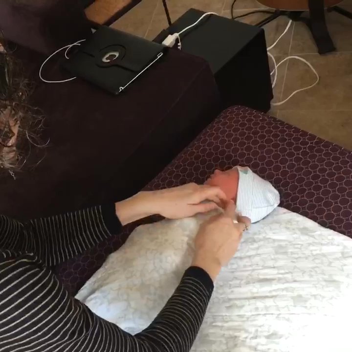 Trinity Midwifery - Lael showing us how to properly swaddle our firstborn boy - Lactation Services Near Me