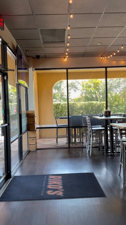 Riko's Pizza - 5/2024 - Arrived just before the lunch special. But spacious, clean, nice lighting, TV screens. Bar area and dining area. - Pizza Near Me - Tequesta, Florida