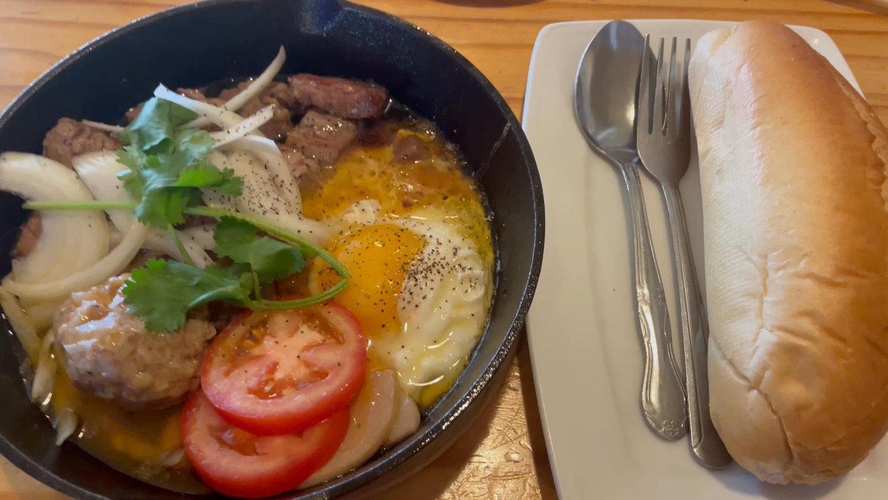 Pho Anh Dao Alameda - Banh Mi Chao. I would recommend fishing out the meats from the cast iron pan so that it's not sitting in oil - Vietnamese Near Me - Alameda, California