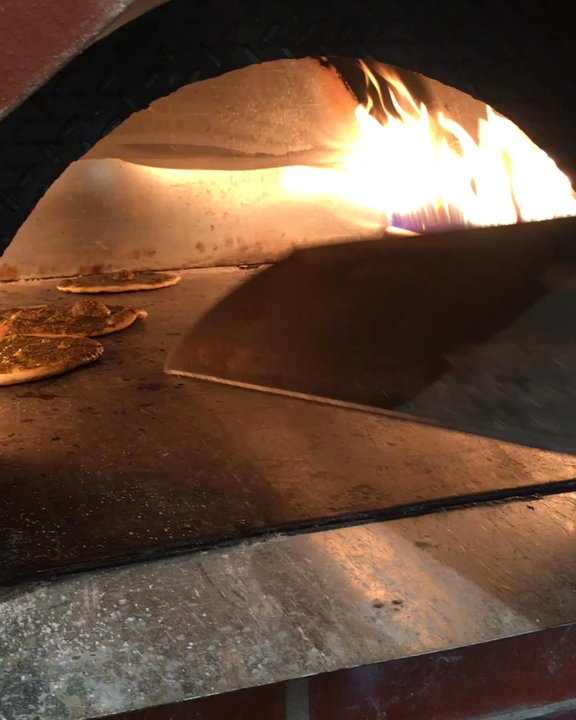 Rest House Cafe - Manaeesh- Lebanese cheese or oregano flatbreads that are a popular breakfast item. Pairs well with fresh veggies and a hot cup of tea!! - Hookah Bars Near Me - Houston, Texas