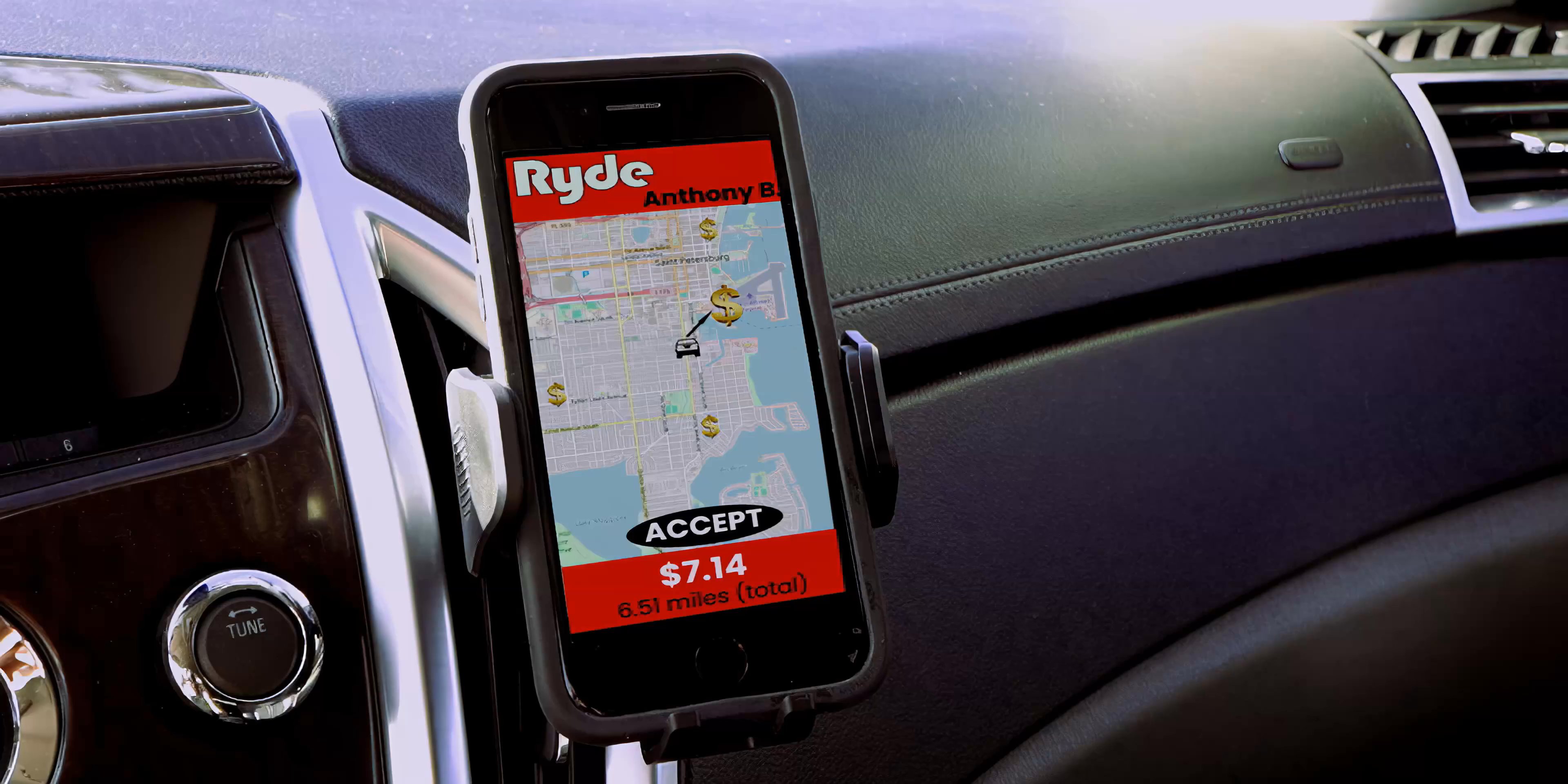 A rideshare driver navigates toward a hospital destination after accepting a ride request on a mobile application. The sequence transitions from aerial coastal views to driving through a city landscape toward the medical facility.