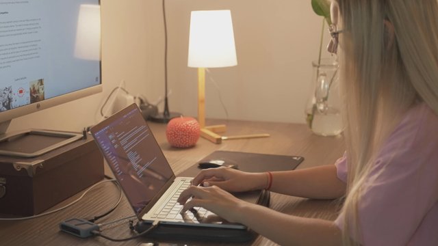 Student doing a marketing assignment on her laptop