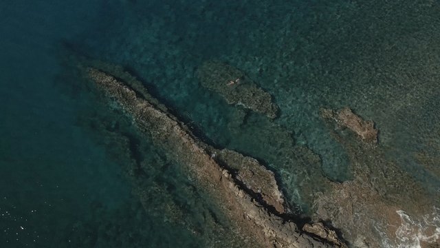 A man is swimming over a mid-ocean ridge