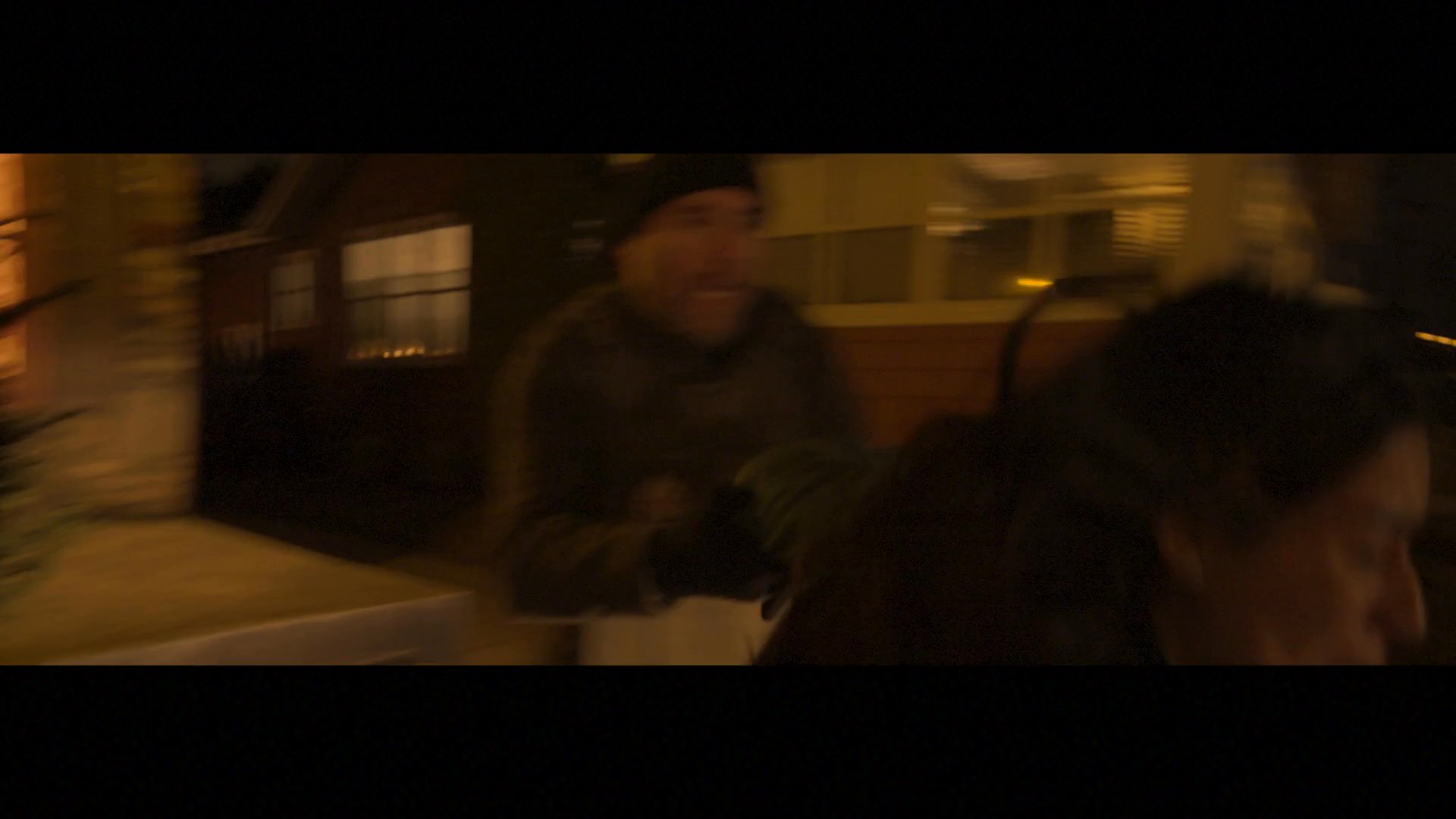 Tactical units conduct a nocturnal arrest in a suburban residential area, apprehending individuals in a high-stakes encounter. The scene captures the transition from active detention to a tense, quiet aftermath in the dark street.