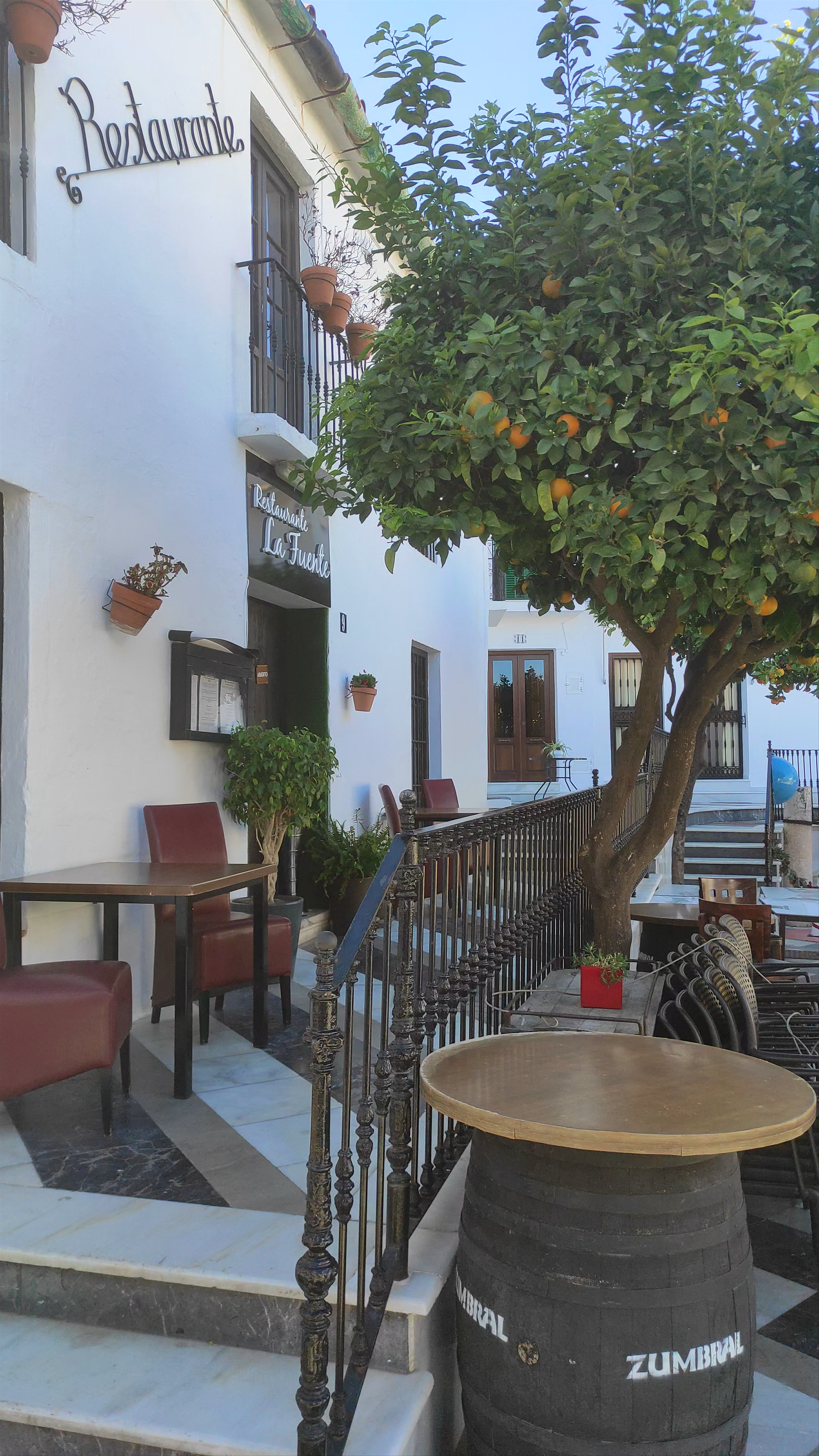 Sunny Plaza de España: Charming Outdoor Dining & Orange Trees in Benalmádena, Spain