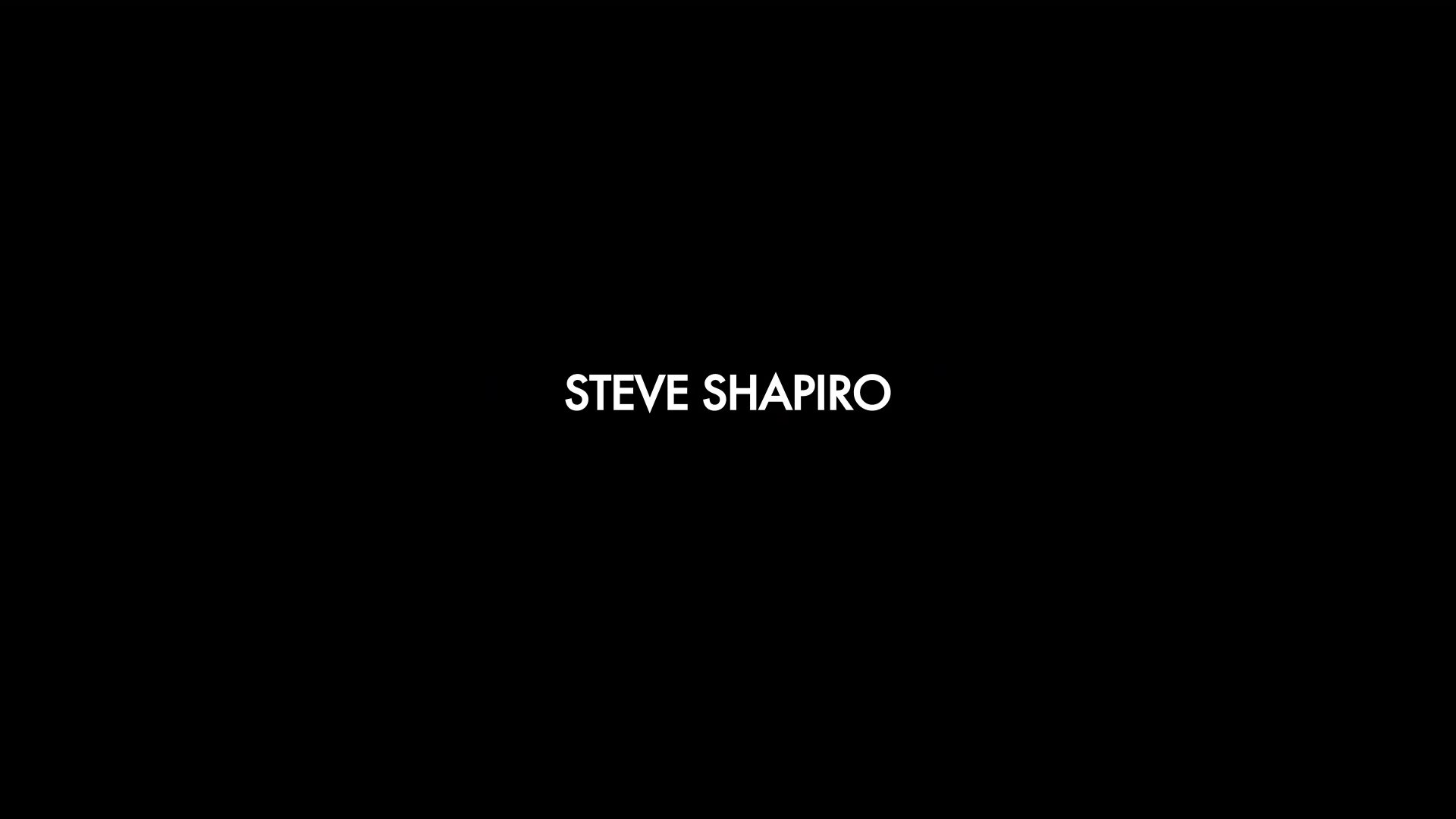 Production credits roll over scenes featuring the lively atmosphere of the Sturgis motorcycle rally, including shots of patrons in a bar and a motorcyclist riding on a road.