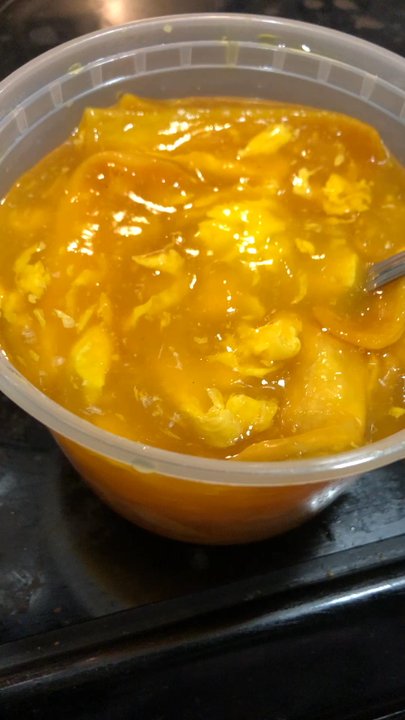 Eat Rice - This is their egg drop soup. As you can see, it's steaming hot and looks like orange marmalade. - Chinese Near Me - Richmond, Virginia