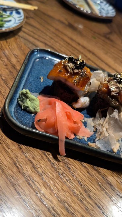 Zundo - Black Diamond Sushi Roll: Kani, cucumber, avocado, eel, foie grass, black tobiko (caviar), edible gold leaf, (Black rice), and bonito flakes - Ramen Near Me - Lexington, Kentucky