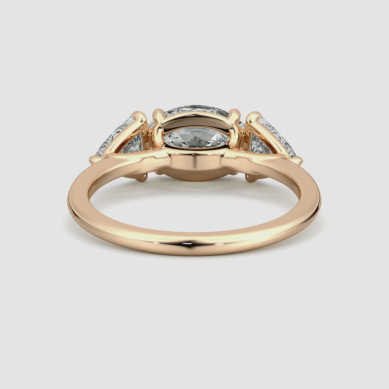 The Three Stone | Oval | 14k | Rose Gold | bandAccent: Plain | diamondOrientation: horizontal | sideStoneCarat: 0.50ct | sideStoneShape: Trillion | caratWeight: other