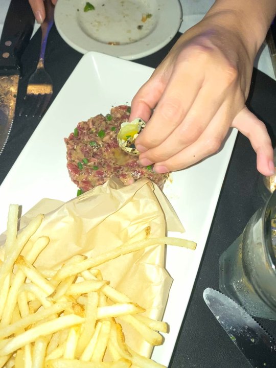 Peter's Inn - The quail egg on the steak tartare - New American Near Me - Baltimore, Maryland