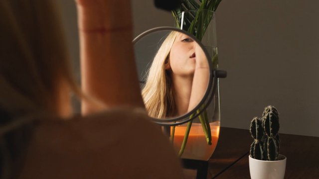 A woman contouring her face