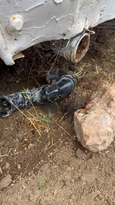Spaceport Rv Park - Sewage leaking out below trailer from swer pipe out of ground - RV Parks Near Me - Mojave, California