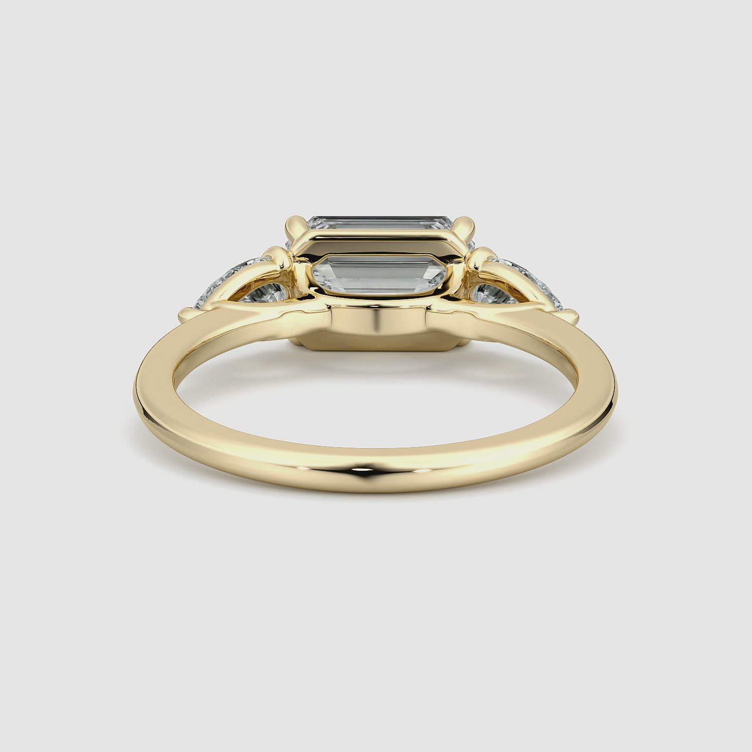The Three Stone | Emerald | 18k | Yellow Gold | bandAccent: Plain | diamondOrientation: horizontal | sideStoneCarat: 0.25ct | sideStoneShape: Pear | caratWeight: other